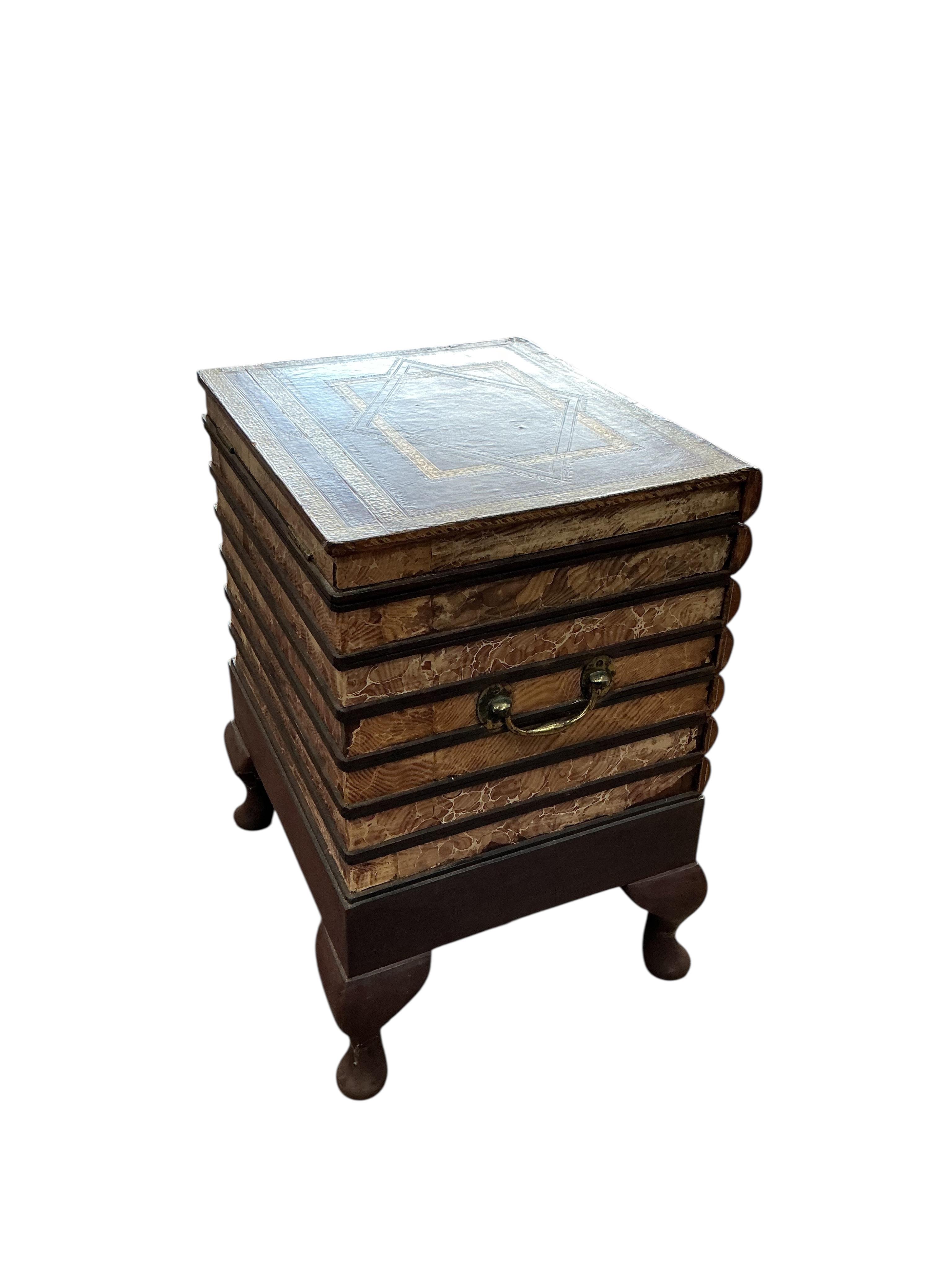 A reproduction cellarette modelled as a stack of antiquarian books, width 42cm, depth 37cm, height 58cm